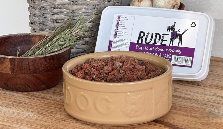 packaging and bowl filled with Rude Dog Food, Hypoallergenic raw lamb, and venison