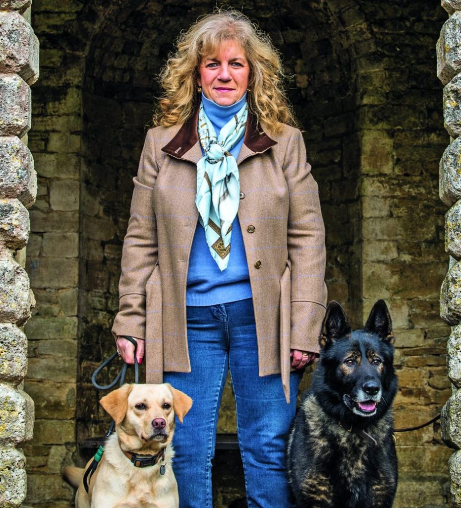 The NFRSA founder stood next to two retired service dogs. 
